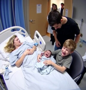 As his older brother cradled him for the first time, the baby—thought to be stillborn—suddenly let out a strong, unexpected cry.